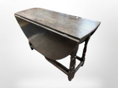 A 19th century oak gate leg table,