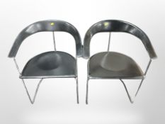A pair of contemporary chrome and black stitched vinyl chairs