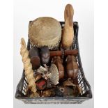 A collection of ethnographic items, including carved busts, pair of elephant bookends,