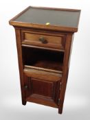 A mahogany bedside cabinet fitted a drawer,