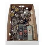A box containing stainless steel goblets, silver-plated bud vases, cruet set, cutlery,