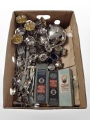 A box containing stainless steel goblets, silver-plated bud vases, cruet set, cutlery,