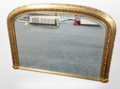 A Victorian style gilt domed top overmantel mirror,