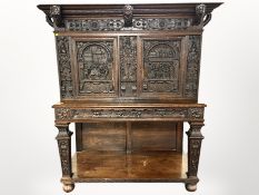 A 18th century Flemish carved oak court cupboard,