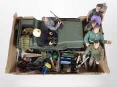 A collection of Action Man toys including army jeep, several figures, equipment including clothing,