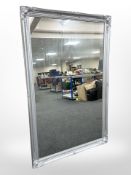 A silvered overmantel mirror,