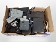 A collection of vintage cameras and handheld video cameras including Canon, Bolex, Minoltina, etc.