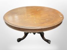 A Victorian mahogany circular dining table, on carved base,