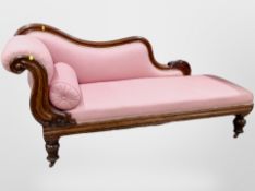 A Victorian carved walnut chaise longue,