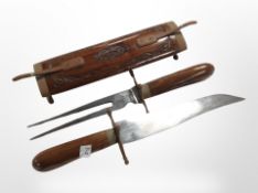 An Indian two-piece carving set, and a carved wooden sheath.