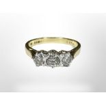 An 18ct gold three stone diamond ring, size CONDITION REPORT: 3.