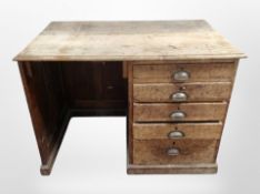 A late Victorian oak single pedestal desk, fitted five drawers,