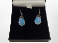 A pair of silver moonstone drop earrings, boxed.