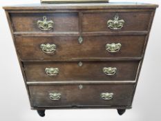 A George III oak chest of five drawers,