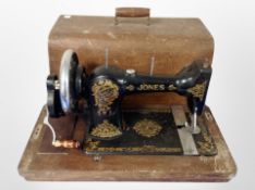 An antique Jones hand sewing machine.