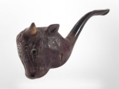 A vintage smoking pipe with bull's head bowl.