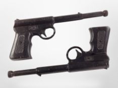 Two Gat vintage air pistols.