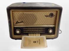 A mid-20th century Bush bakelite-cased valve radio.