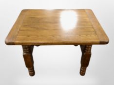 A reproduction oak coffee table, width 78 cm,