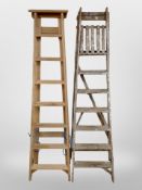 Two wooden step ladders