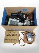 A collection of vintage cameras and handheld video cameras including Yashica, Copil, etc.