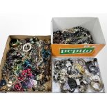 Three boxes containing a large quantity of costume jewellery, including bead necklaces, bangles,