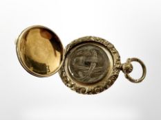 An antique yellow gold backed memorium locket, diameter 28 mm.