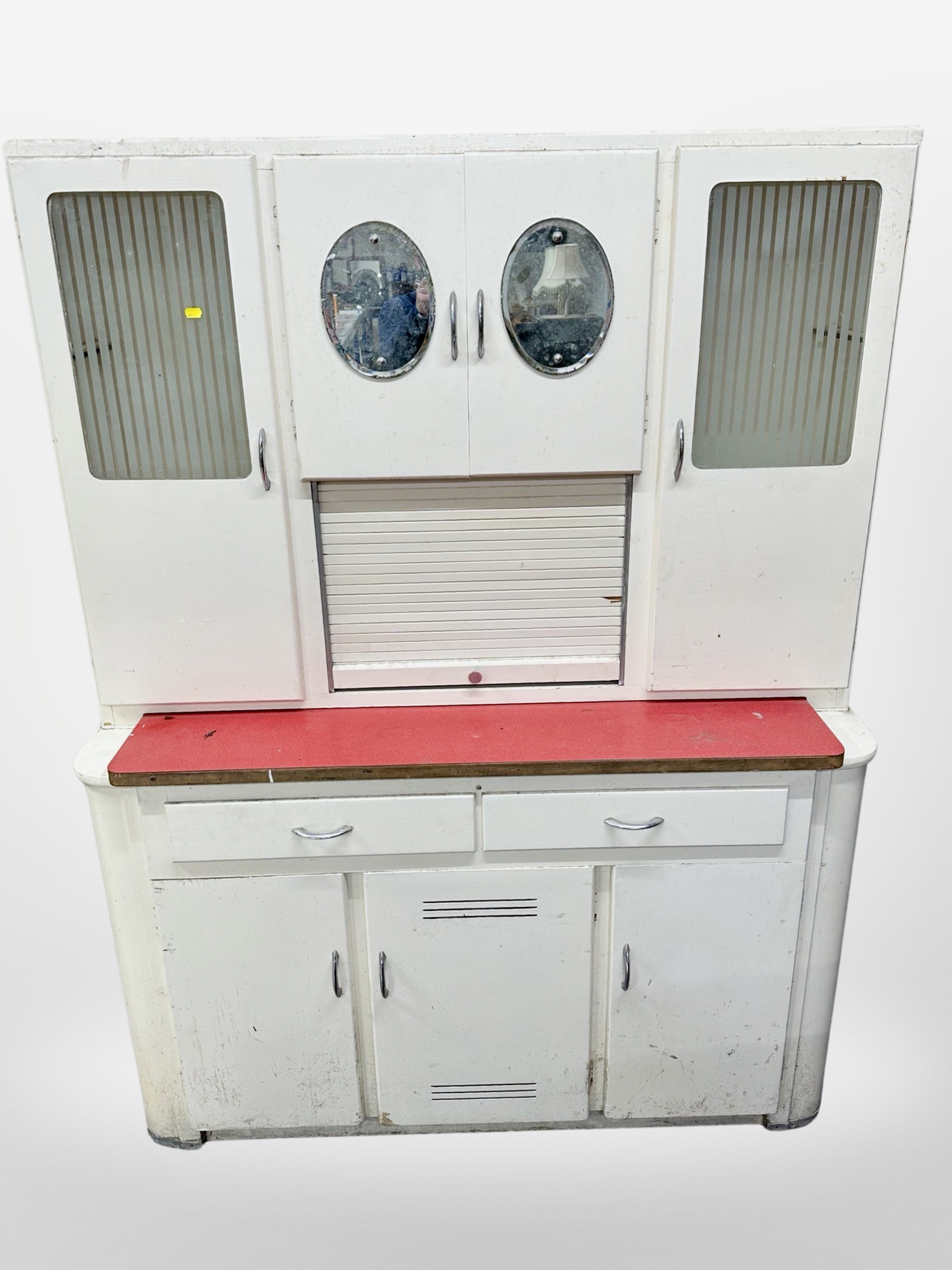 A 1950's kitchen cabinet with melamine top, width 144 cm
