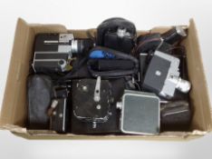 A collection of vintage cameras and handheld video cameras including Kodak, Sankyo, etc.