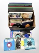 A box of LP boxsets and 45 singles, mixed artists and genres including Queen.