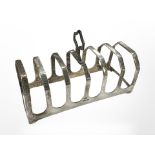 A silver seven-bar toast rack, Sheffield marks, length 11cm. CONDITION REPORT: 70.