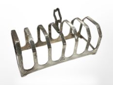 A silver seven-bar toast rack, Sheffield marks, length 11cm. CONDITION REPORT: 70.