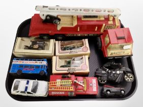 A group of boxed and unboxed diecast models, including Lledo, Corgi, tin plate model fire truck,