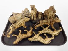 A group of resin cheetah and tiger ornaments.