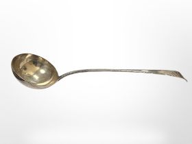 A Georgian silver ladle, marks indistinct, length 35cm. CONDITION REPORT: 205.