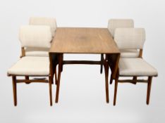 A 20th century drop leaf dining table and four chairs in checkered fabric