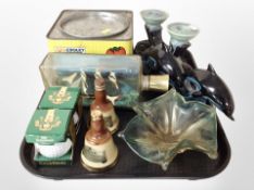 Two Poole dolphins, ship in bottle, two miniature Bell's Whiskey decanters,