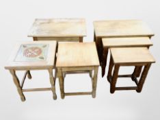 A Danish blonde oak nest of three tables and three similar occasional tables