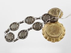 A silver three pence piece bracelet, further gilded coin pendants.