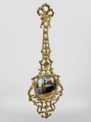 An ornate gilt metal mirror, height 73cm.