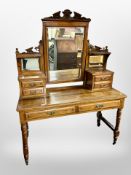 A Victorian carved walnut mirror back dressing table,