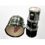 A Pearl drumkit bass drum and three further drums.