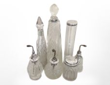 Seven silver-mounted crystal dressing table bottles and atomisers.