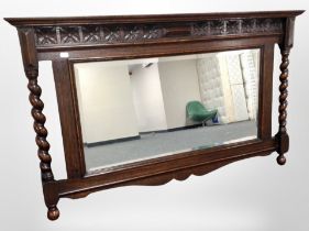 An Edwardian oak barley twist overmantel mirror,