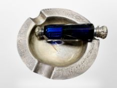 A silver ashtray, diameter 11cm, and a double-ended blue glass scent bottle.