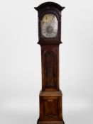 A 19th century continental oak longcase clock with brass and silvered dial,