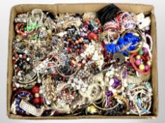 A box of a large quantity of costume jewellery, bangles, bead necklaces, etc.