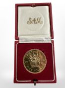 A 1966 Rhodesia 22ct gold five pound coin, 39.94g, in protective red box.