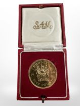 A 1966 Rhodesia 22ct gold five pound coin, 39.94g, in protective red box.