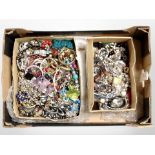 A box of a large quantity of costume jewellery, bangles, bead necklaces, etc.